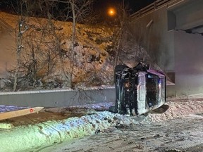 MRC des Collines-de-l'Outaouais police found this vehicle on its side near an overpass in Chelsea, Que., early on the morning of Sunday, Dec. 19, 2021. The driver was charged with impaired driving.