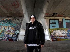 Cody Purcell, aka Cody Coyote poses for a photo under the Dunbar Bridge at Brewer Park.