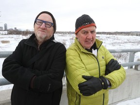Dennis Carr and Steve Pomeroy stand near LeBreton Flats in Ottawa Tuesday. The two men sit on the board of the Ottawa Community Land Trust.