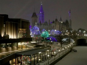 Lights near the National Arts Centre and looking toward Parliament Hill from beside the Rideau Canal.
