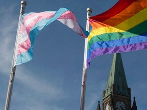 The pride and transgender flags fly on Parliament Hill in Ottawa.