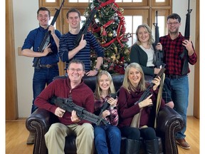 U.S. Rep. Thomas Massie (R-KY) in a Christmas photo of his family holding guns, in this image obtained from Twitter, posted on December 4, 2021.