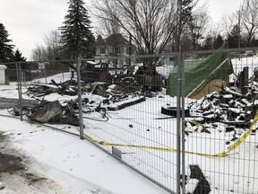 The shells of fire vehicles and debris are fenced off following the fire that destroyed the Portland fire station in late December.