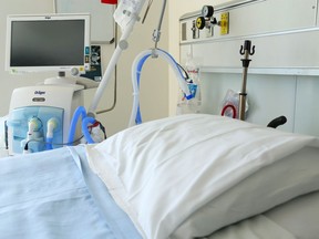 A ventilator stands beside a bed in the regional intensive care unit at Belleville General Hospital in Belleville.
