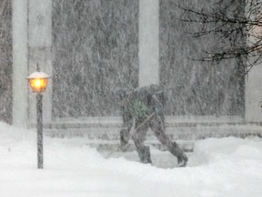 Heavy snow makes shovelling especially difficult in a Nepean neighbourhood.