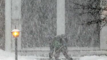 Heavy snow makes shovelling especially difficult in a Nepean neighbourhood.