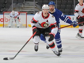 Thomas Chabot #72 of the Ottawa Senators chases back up ice for a puck in a 6-0 loss to the Toronto Maple Leafs at Scotiabank Arena on January 1, 2022 in Toronto,
