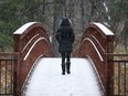 Files: A walker crosses the bridge leading up to the Sugarbush trail in Gatineau Park in Old Chelsea.