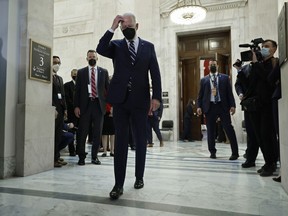 President Joe Biden leaves a meeting with Senate Democrats, urging them to pass a voting rights bill. A divided Democratic party and a resurgent Donald Trump is one of the likely scenarios heading into 2022.