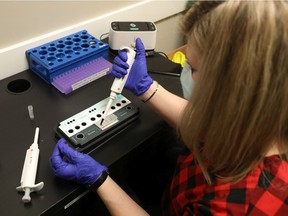 Nurse Melissa Hall processes a COVID-19 test at Bridlewood Medical Centre in Kanata. The clinic offers same day test results for $225.