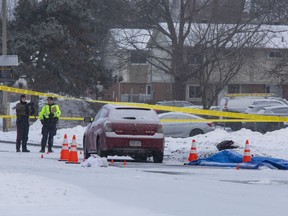 The Ottawa police collision investigations unit at the scene where a pedestrian died early Friday after being struck by a vehicle near the intersection of Moodie Drive and Old Richmond Road.