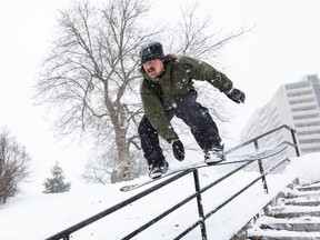 Files:- Mike Rowan enjoying the weather while street snowboarding on Monday, Jan. 17, 2022. It could get messy out there again today.