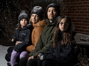 Fredrique Chabot and Mike Godbout with their children Simone, 6, and Léo, 9, who both attend the French public board school named for lawyer and former Supreme Court justice Louise Arbour.