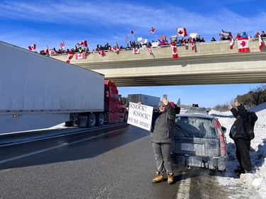 Supporters of truckers protesting the Canadian government's vaccine mandate for cross-border truckers gathered on the Dilworth Road highway 416 overpass as the convoy made its way to Ottawa. Friday, Jan. 28, 2022