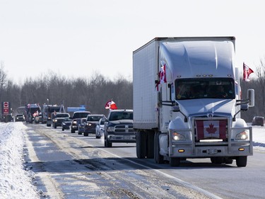 Supporters of truckers protesting the Canadian government's vaccine mandate for cross-border truckers gathered on the Dilworth Road highway 416 overpass as the convoy made its way to Ottawa. Friday, Jan. 28, 2022