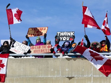 Supporters of truckers protesting the Canadian government's vaccine mandate for cross-border truckers gathered on the Dilworth Road highway 416 overpass as the convoy made its way to Ottawa. Friday, Jan. 28, 2022