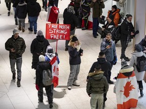 Unmasked protestors were inside the Rideau Centre shopping centre on Saturday. The mall was closed in late afternoon.