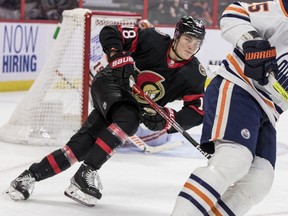 Senators left wing Tim Stuetzle (18) pursues Edmonton Oilers defenceman Darnell Nurse (25) during first period NHL action at the Canadian Tire Centre on January 31, 2022.