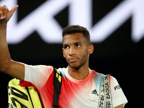 Canada's Felix Auger-Aliassime acknowledges the fans after loosing against Russia's Daniil Medvedev during in the men's singles quarter-final match on day ten of the Australian Open tennis tournament in Melbourne on January 27, 2022.