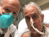 David Bennett, right, poses with surgeon Dr. Bartley Griffith before receiving a successful transplant of a genetically-modified pig heart at University of Maryland Medical Center in Baltimore, Maryland.