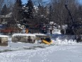 First responders have removed the infamous yellow "selfie" car that plunged through the ice on the Rideau River last weekend in Manotick.