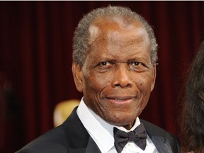 A file photo of the late Sidney Poitier taken at the Academy Awards in 2014. Fifty years earlier, Poitier played an important role in bolstering the Mississippi civil rights movement with his friend Harry Belafonte.