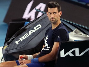 Files: Novak Djokovic of Serbia attends a practice session ahead of the Australian Open tennis tournament in Melbourne on January 14, 2022.