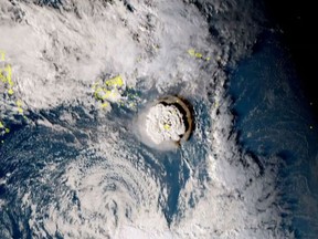 A grab taken from footage by Japan's Himawari-8 satellite and released by the National Institute of Information and Communications (Japan) on January 15, 2022 shows the volcanic eruption that provoked a tsunami in Tonga.