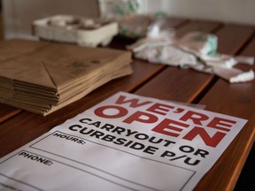 A 'We're Open' sign sits on a table at a restaurant in Mobile, Alabama, in May 2020 after the state lifted a stay-at-home order.