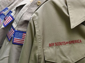 FILE - In this Feb. 18, 2020, file photo, Boy Scouts of America uniforms are displayed in a retail store.