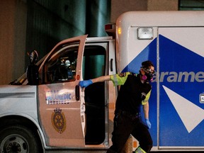 An ambulance crew delivers a patient at Mount Sinai Hospital in Toronto, Ontario, Canada, on Jan. 3.