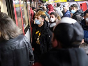 Commuters wait for the train at the subway station, amid the outbreak of the coronavirus disease (COVID-19) and after Omicron has become the dominant coronavirus variant in Europe, in Barcelona, Spain January 12, 2022.