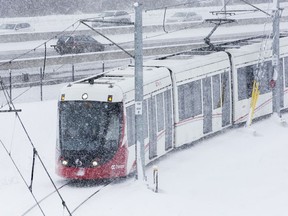 A train pulls into the Cyrville Station as LRT deals with a heavy snow day.