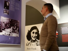 FILE PHOTO: A man looks at an exhibition about Anne Frank at the Victory museum in Sibenik, Croatia, February 3, 2017.