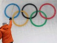 An ice maker installs a sub-glacial Olympic logo ahead of the Beijing 2022 Winter Olympics at Yanqing National Sliding Centre in Yanqing, China.