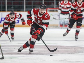 Ontario Hockey League Regular Season game between the Peterborough Petes and the Ottawa 67's.  Ottawa 67's forward Alex Johnson carries the puck up-ice.