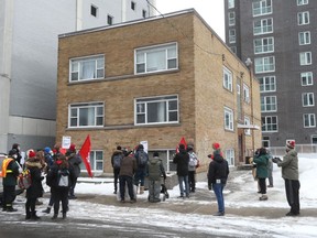 Tenants and others gathered outside 142 Nepean St. on Thursday to protest against the proposed demolition of the building.