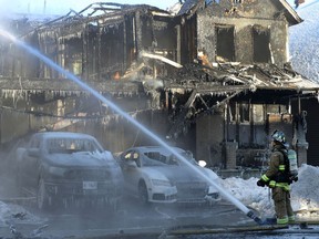 Ottawa Fire Services battled a fire which destroyed two homes and several cars at Aridus Cres in Ottawa Thursday morning.