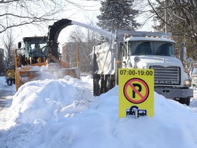 Snow removal crews taking away the snowbanks on Glebe Ave in Ottawa Jan. 25, 2022