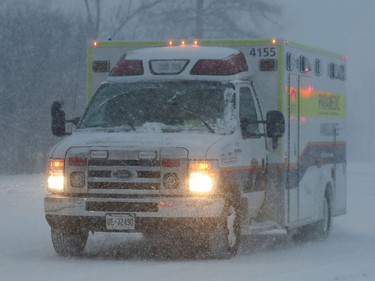 OTTAWA - Jan 17 2022 - A ambulance going through the snow Monday.