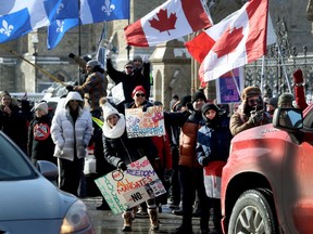 A couple hundred anti vaccine mandate protesters and truckers arrived on Wellington Street in Ottawa Friday afternoon.