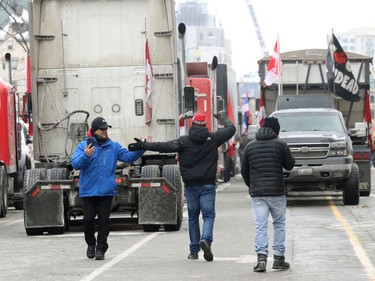 Anti vaccine mandate protesters and truckers still protesting on Wellington Street in Ottawa Monday morning.