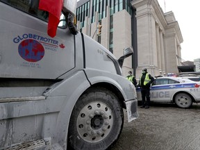 Ottawa police on Wellington Street on Monday as the hauliers' protest continued.