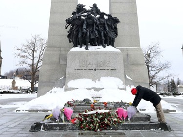 Member of Parliament Frank Caputo cry as he stops and pays his respects to the tomb of the unknown soldier at the National War Memorial in Ottawa Monday morning. Frank is the shadow minister for veterans affairs.