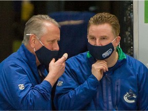 Vancouver Canucks Equipment Manager Pat O'Neill (left) and Brian Hamilton, Assistant Equipment Manager prior to playing Ottawa Senators in NHL hockey at Rogers Arena in Vancouver, BC, January 27, 2021. Hamilton discovered a malignant melanoma on his neck after a Seattle Kraken fan got his attention during an October NHL game.