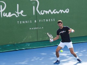 Serbian tennis player Novak Djokovic trains at Puente Romano Tennis Club in Marbella, Spain, January 2, 2022.
