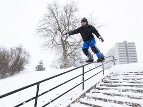Jordan Bell enjoying the weather while street snowboarding.