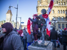 Newsmakers 2022: The “Freedom Convoy” 4 Thousands of people gathered in downtown Ottawa on January 29, 2022. A protester stood on the statue of Terry Fox, which was outfitted with Canadian flags and had signage pasted on it.