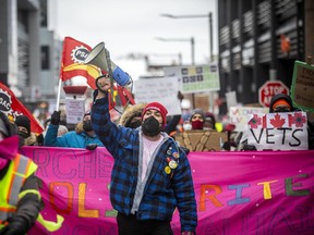 Ottawa-area residents opposed to the truck convoy protest downtown, gathered at Lansdowne Park before marching through the Glebe on Saturday.