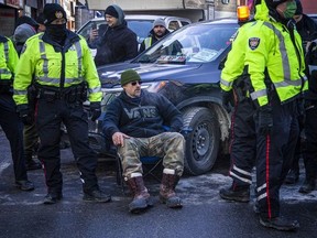 Newsmakers 2022: The “Freedom Convoy” 3 Ottawa by-law officers, backed by police, were in the red zone, issuing parking tickets and fines that read